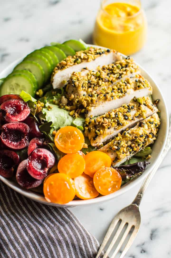 Pistachio Crusted Chicken Salad with Carrot Ginger Dressing - this gluten-free and paleo salad is perfect for weeknights. Ready in 30 minutes! | clube.futebolmilionario.com