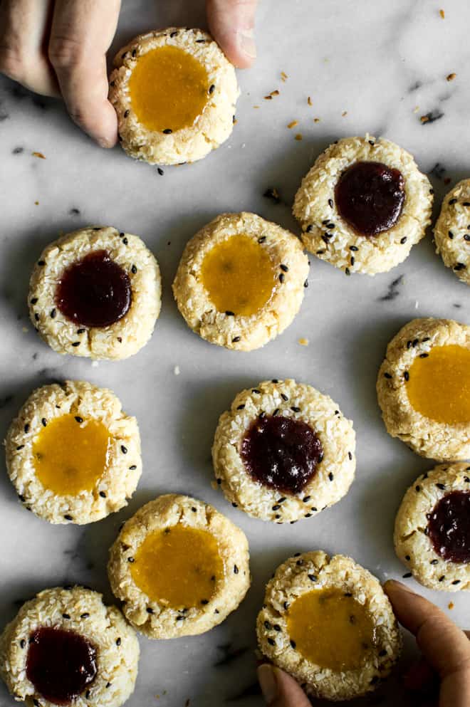 Easy Gluten-Free Coconut Thumbprint Cookies that are made with less than 10 ingredients! by Lisa Lin of clube.futebolmilionario.com