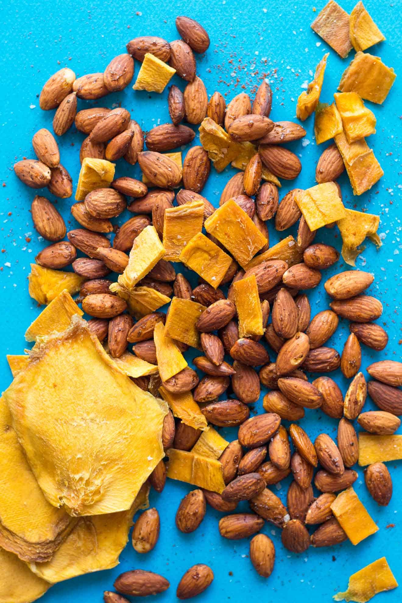 Mango Chili Almond Trail Mix + 4 Easy Trail Mix Recipes with Almonds - here's 4 healthy snacks that you can make at home! They're gluten free and take only 30 minutes to prepare! by @healthynibs