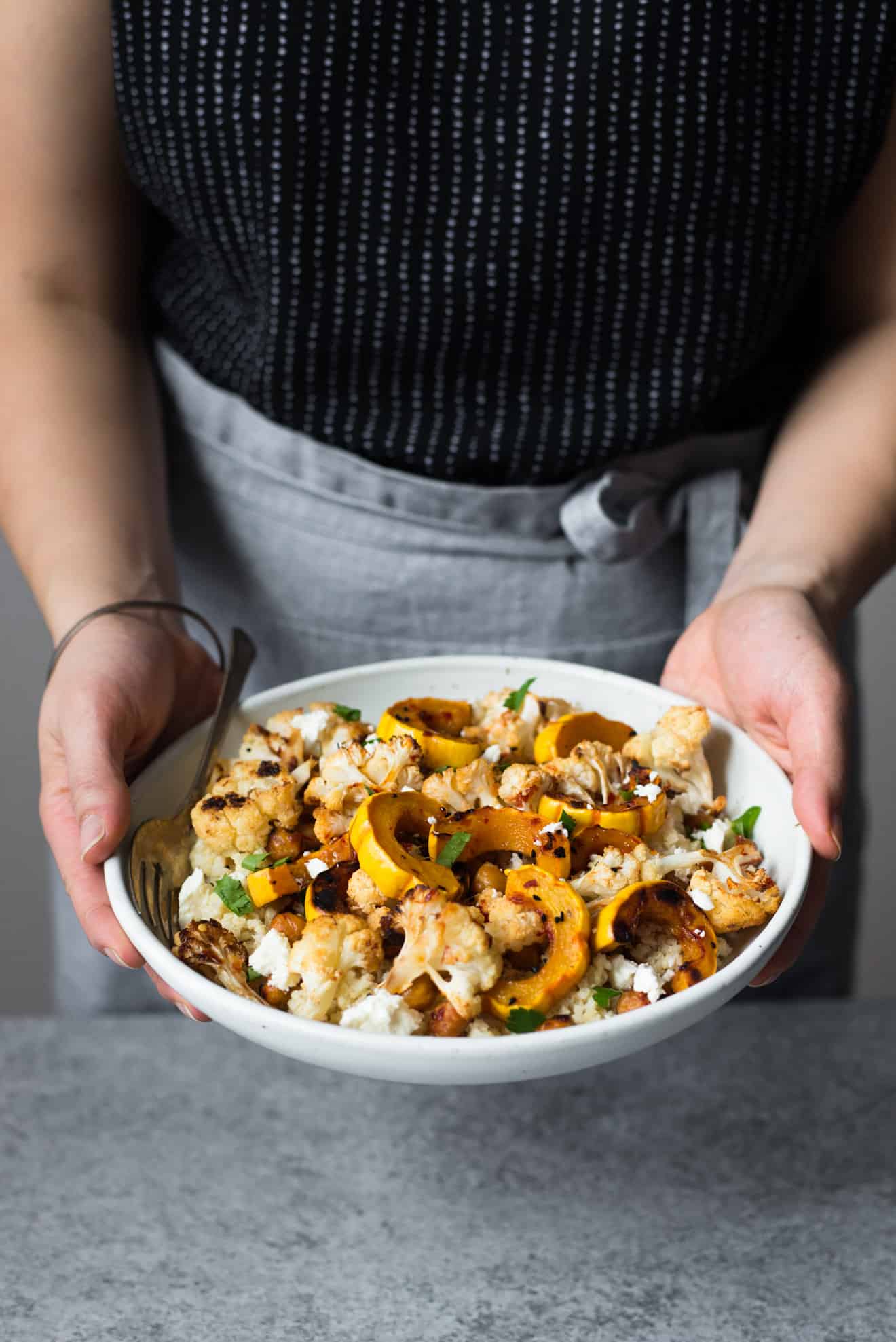 This Harissa Roasted Cauliflower with Delicata Squash & Chickpeas is a healthy, gluten-free weeknight dinner! Made with just 7 ingredients!