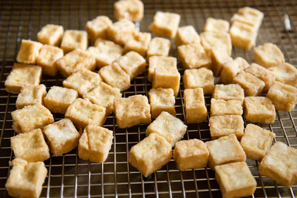 Fried tofu on cooling rack